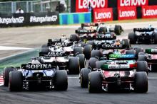 Alexander Albon (THA) Williams Racing FW44 and Guanyu Zhou (CHN) Alfa Romeo F1 Team C42 at the start of the race. Formula