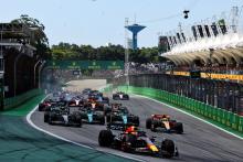 Max Verstappen (NLD) Red Bull Racing RB19 leads at the start of the race as Alexander Albon (THA) Williams Racing FW45 and